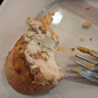 Ultimately spreadable cashew cheese on satisfyingly toasted and crunchy sliced baguette. at Blossoming Lotus - Irvington in Portland