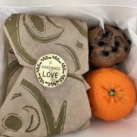 Vegan breakfast sandwich and comes with a vegan blueberry muffin and orange - so cute!  at UT47 Manhattan in New York City