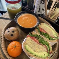 Chickpea and avocado sandwich with creamy tomato soup. Arrived as a whole meal with vegan blueberry muffin and orange    at UT47 Manhattan in New York City