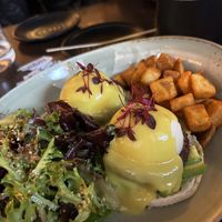 Vegan eggs Benedict with fried potatoes and side salad.   at UT47 Manhattan in New York City