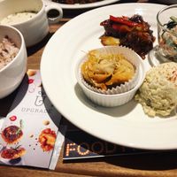 4 piece dish, fried chicken in spicy sauce (winner), veggie dumplings, potato salad and peanut and fig salad. Comes with soup and a rice or bread. at Upgrade Plant Based Kitchen in Osaka