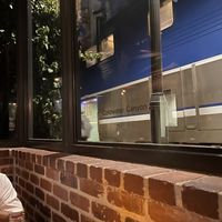 Amtrak Surfliner making a stop   at Trevor's at the Tracks in San Juan Capistrano