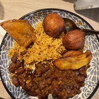 Samosa, puff puff, plantain, jollof rice and beans - yummy!!!  at Patacon-Obi - Falafel Café in Stuttgart