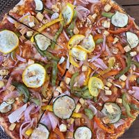 Vegan pizza with tofu   at Hope Cafe in Pondicherry