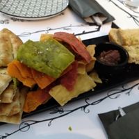 Bread, pita bread and fried slices of vegetable flavored flour and olive paste at Tis Mammis Sou in Rhodes