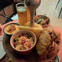 Potato rostis, pineapple, arancini balls (behind the rosti) nacho cheese sauce on the left, savoury broth in the glasses, and a wee risotto with bacon bits too. Everything unbeliev at Atelier Flori in Bruges