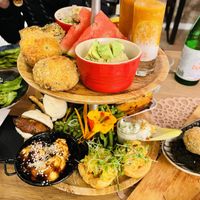 Tray for two: tomato soup, risotto balls, couscous, avocado hummus, quiche, sweet/sour cauliflower, mushrooms, and more!  at Atelier Flori in Bruges
