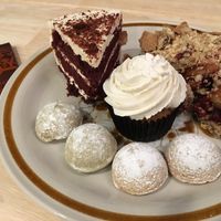 Red velvet cake, apple cranberry pie, vanilla cupcake, matcha tea cookies, and vanilla bean hibiscus tea cookies  at Askatu in Seattle