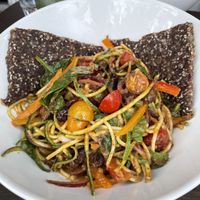 Olive Tepanade tepanade zoodle bowl with sprouted onion bread  at Raw Aura in Mississauga