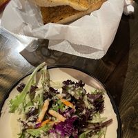 Garlic olive oil bread and salad with tahini dressing that was excellent ! at Nine Mile Montford in Asheville