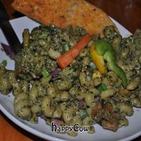 Irie Ites: Tofu sauteed with white wine, garden fresh vegetables, in a creamy dairy free basil pesto. Tossed with cavatappi pasta & spring onions. at Nine Mile Montford in Asheville