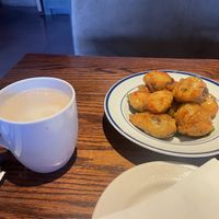 Oatmilk Carmel latte and the crispy brussel sprouts   at Cafe Sunflower in Atlanta