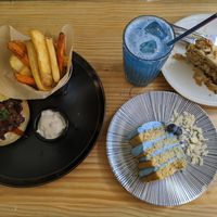 Bbq jackfruit burger with fries, blue spirulina cake and lemonade, carrot cake at Frutas Prohibidas in Madrid