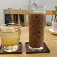 Iced jasmine tea and iced Vietnamese coffee (plant milk options) at Nâunâu in Ho Chi Minh City