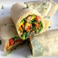 Veggies rotis rolls (vegan)
Stir-fried potato, carrot, red cabbage, spinach, fresh roket, tomato, avocado &homemade veggies sauce, in rotis with three-nut sauce on the side at Santorino Coffee & Veggies in Ho Chi Minh City