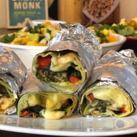 Grilled tortillas with spinach, mozzarella, garlic mushroom, bell pepper, sauteed tofu & homemade pesto sauce at Santorino Coffee & Veggies in Ho Chi Minh City