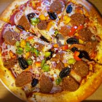 I ordered the Beyond Sausage pizza and I couldn't be more pleased. 😍 at T-Mama's Gourmet in Aurora