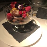 Indulgent avocado chocolate mousse with fresh berries. at Fellinis in Ambleside