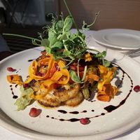 Cauliflower steak with cheese or vegan   at Fellinis in Ambleside