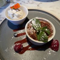 Rhubarb & ginger crumble with vegan ice cream  at Fellinis in Ambleside