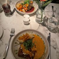 Top: Aubergine rolls, roasted vegetables, boulangerie potato and red wine sauce. Below: Roasted vegetables and almond baklava with harissa mash and red pepper sauce.  at Fellinis in Ambleside
