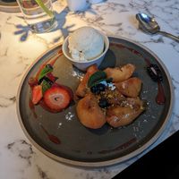 Roasted peaches with thyme and vegan ice cream. Really good! at Fellinis in Ambleside