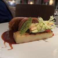 Puy lentil & cashew nut roast with boulangère potato, roasted vegetables & red wing jus  at Fellinis in Ambleside