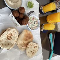 Take away falafel, hummus, pita and tahini salad   at Abu Jbara in Amman