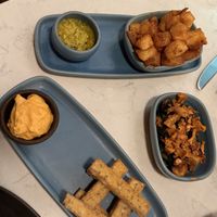 Polenta fries, potato bravas, chard and onions  at Glas Restaurant in Dublin