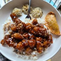 Sesame chicken, curry pockets, and steamed dumplings at Harmony Vegetarian in Chamblee