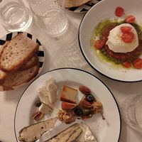 Cheese plate with 5 different vegan cheeses and burrata with tomato ragu and pesto sauce at Pepper & Ginny - Vegane Veinkost in Vienna