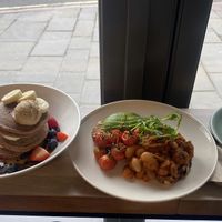 Banana pancakes, homemade beans, americano  at Rask in Derby