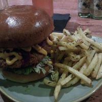 Fried chick'aint bun, rosemary truffle fries and Flora Dora cocktail. at Ninety Nine Bar and Kitchen in Aberdeen