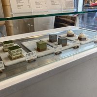 Display case with items - matcha tiramisu, black sesame cheesecake, citrus tart  at Soi & Co in Berlin
