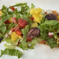 Raw vegan pizza slice   at Tehuti Cafe in Kingston