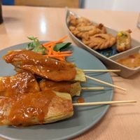 Mock chicken satay, and curry puffs. at Madame K's Vegan- CBD in Melbourne