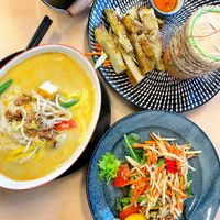 Laksa and papaya salad with chick’n and sticky rice, super good!  at Madame K's Vegan- CBD in Melbourne