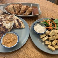 Entrees: curry puffs, roti, Japanese tofu  at Madame K's Vegan- CBD in Melbourne