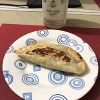 Empanada y queso crema vegano at Vegan For The Animals Food in Bogota