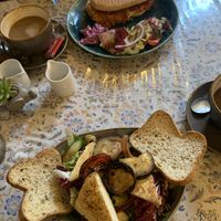 Vegan gf tofu & grilled veg salad (front), vegan sausage panini (back)  at Leila's Kitchen in Hebden Bridge