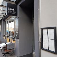 Exterior and limited outdoor seating at Masi Wine Bar in Zurich
