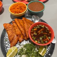 Birria with side of refried beans and rice at Cascabel in Houston