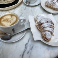 Chocolate croissant and oat milk latte  at The Vegan Corner in Barcelona
