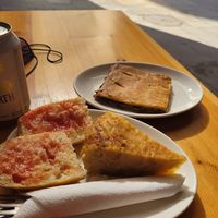 Tomato bread, tortilla de patatas and vegetable empanada. at The Vegan Corner in Barcelona