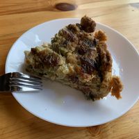 Asparagus and leek quiche- so savory and delicious- also found a few sundried tomatoes in there😻  at The Vegan Corner in Barcelona