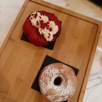 Red velvet Berliner with chocolate and doughnut with chocolate at The Vegan Corner in Barcelona