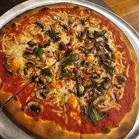 Plain cheese pizza 🍕 with added mushrooms at Dudley's in Olinda