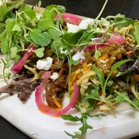 Cucumber Tostadas:  Cashew “Feta”, Red Onions, Micro-Greeens at Juice By J in Grand Rapids