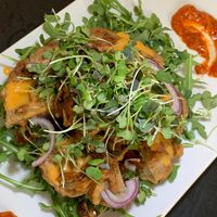 Stuffed "Wacky" Waffle Burger: Almond & Oat Waffle, Garbanzo & Jackfruit Patty, Pine Nuts, Sun-Dried Tomato Sauce, Arugula, Micro Greens at Juice By J in Grand Rapids