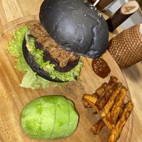 Burger with extra avocado and sweet potato fries  at Roots in Hanoi